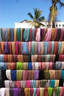 Tanzania: Zanzibar, StoneTown, shawls for sale at outdoor stand