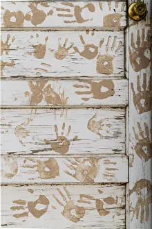 Faded Prints: Taos Pueblo, New Mexico, United States. Handprint door detail
