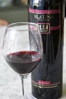 Images Dated 14th July 2006: Tasting room, bottle of Blatina Vrhunsko Suho Vino red wine. Vinarija Citluk winery