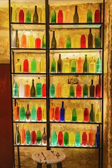 Decorative Prints: Tataouine, Tunisia. A rack of bottles filled with colored water