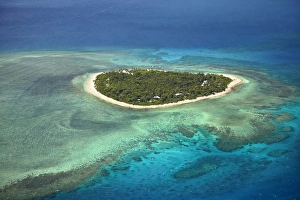 Barrier Prints: Tavarua Island and coral reef, Mamanuca Islands, Fiji, South Pacific - aerial