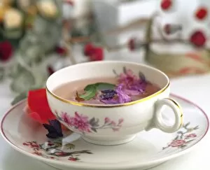 Tea cup with flowers and herbs