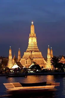 Dark Prints: Temple of Dawn (Wat Arun) at dusk with boat on Chao Phraya River, Bangkok, Thailand