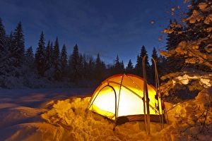 Images Dated 5th December 2010: Tent glows at dusk during winter camping near West Glacier, Montana, USA