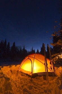 Images Dated 5th December 2010: Tent glows at dusk during winter camping near West Glacier, Montana, USA