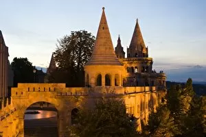 The terrace and conical towers of Fishermens Bastion next to Matyas Church, dusk