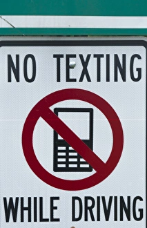 Images Dated 2029: NO TEXTING WHILE DRIVING sign dangerous practice