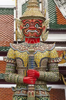 Thailand, Bangkok, .giant demon Suryapop guards the eastern entrance of Emerald Buddha