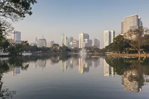 Images Dated 27th November 2018: Thailand, Bangkok. Lumphini, Lumphini Park, city skyline at dawn