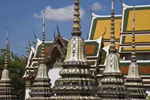 Images Dated 10th April 2008: Thailand, Bangkok. The ornately decorated stupas of Wat Pho