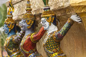 Royal Palace Prints: Thailand, Bangkok, Royal Palace. Yaksha (demons) guard one of the golden chedi