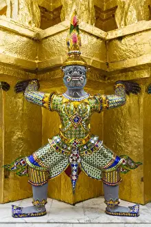Buddhism Prints: Thailand, Bangkok. Yaksha (demons) guard one of the golden chedi at Wat Phra Kaew