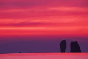 L Imestone Prints: Thailand, Phang Nga Bay. Pink sky reflected in sea with jagged karst (limestone) islands