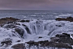 Cape Perpetua Prints: Thors Well with surf cascading into the well along the Oregon coastline