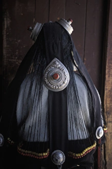 Tibetan Prints: Tibetan woman with prayer wheel and hair jewelry