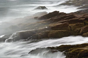 Time exposure of waves crashing against granite coastline at dawn, Mount Desert Island