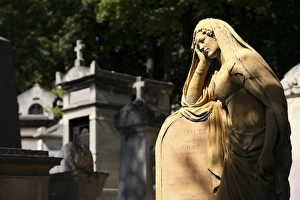 A tomb statue in Cimetiere du Pere Lachaise. Paris. France