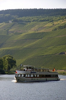 Images Dated 17th June 2006: Tour boat on the Mosel River in northwest Germany with vineyards on the hillside