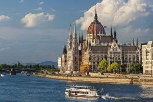 Budapest Prints: Tour boat passes Hungarys Parliament, built between 1884-1902 is the country