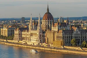 Images Dated 6th October 2021: Tour boat passes Hungarys Parliament, built between 1884-1902 is the country