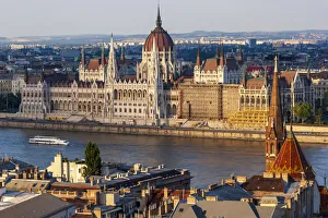 Images Dated 6th October 2021: Tour boat passes Hungarys Parliament, built between 1884-1902 is the country