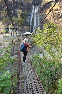 Filipino Prints: Tourist walking on suspending bridge with waterfall, Baguio, Benguet Province, Philippines