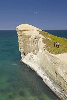Images Dated 4th December 2011: Tourists on cliff top at Tunnel Beach, Dunedin, South Island, New Zealand