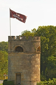 Bordeaux Prints: A tower in the vineyard at Chateau Cos d Estournel with a flag with the name