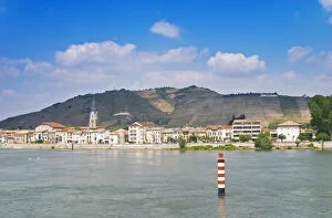 The town Tain l Hermitage, the river Rhone, The Hermitage vineyards on the