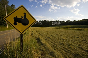 Roadway Prints: A tractor crossing sign next to a farm in Pepperell, Massachusetts