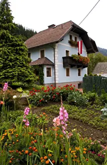 Austrian Prints: Traditional home with flowers in village of Tamsweg Austria in Alps alpine