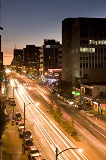 E O Reed Prints: Traffic streaks by on a busy street in Vancouver, BC, Canada