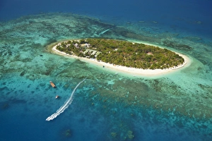 Turquoise Prints: Treasure Island Resort and boat, Mamanuca Islands, Fiji, South Pacific - aerial