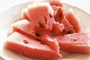 Images Dated 11th July 2006: Triangular pieces of red water melon Shalqi on a white plate. Berat lower town. Albania