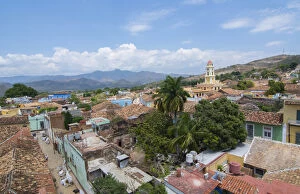 Cuba Collection: Trinidad Cuba from above tower with church and mountains with buildings of tile roofs