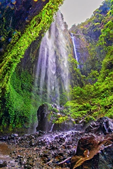 Images Dated 14th September 2024: Tumpak Sewu is a breathtaking panoramic cascade plunging over a cliff into a turquoise pool below