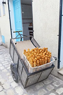 Wagon Prints: Tunis, Tunisia. Loaves of bread in a cart at a bakery
