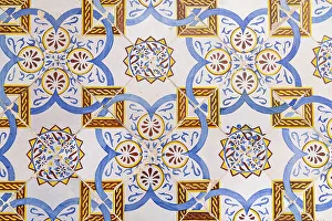 Multicolored Prints: Tunis, Tunisia. Yellow and blue decorative tiles on a house near the Tunis Souk