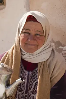 Tunisian Prints: Tunisia, Ksour Area, Metameur, middle-aged Tunisian woman serving tea (MR)