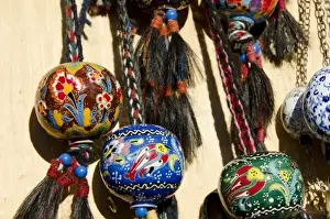 Images Dated 11th September 2011: Turkey, Istanbul. Colorful hand painted souvenir pottery globes with horse hair