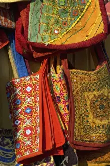 Cappadoccia Prints: Turkish vendor selling colorful cloth purses in Cappadoccia