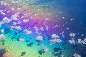 U. S. Virgin Islands, St. Thomas. Aerial view of clouds and rainbow over the Caribbean Sea