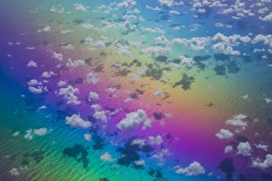 U. S. Virgin Islands, St. Thomas. Aerial view of clouds and rainbow over the Caribbean Sea