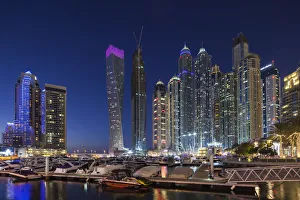 UAE, Dubai, Dubai Marina, high rise buildings including the twisted Cayan Tower, dusk