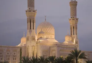 Inscription Prints: UAE, Dubai. Mosque illuminated at sunset