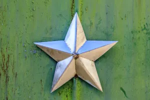 Still Life Prints: Ukraine, Pripyat, Chernobyl. Decorative silver Soviet star on a green wall
