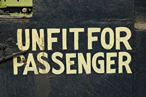 Passenger Prints: Unfit for passengers sign on train parked at train station, Udaipur, India
