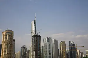 Construction Prints: United Arab Emirates, Dubai. Building construction amid skyscrapers
