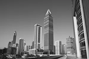 Images Dated 1st March 2007: United Arab Emirates, Dubai, Dubai City. Tower-Up Building and Sheik Zayed Road Highrises