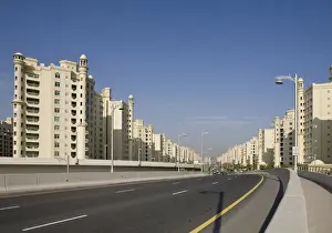 Apartment Prints: United Arab Emirates, Dubai. Road into the Palm Jumeirah with apartment buildings